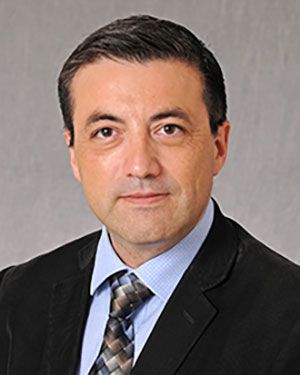 Dr. Alejandro Villagra posing for a portrait