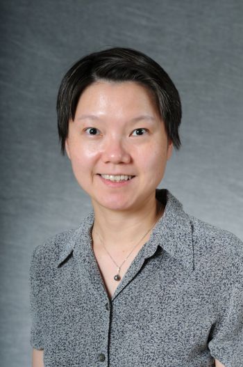 Dr. Mei-Yi Wu standing for a portrait