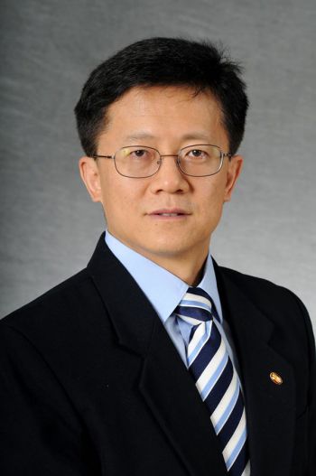 Dr. Wenge Zhu standing for a portrait