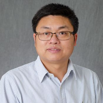 Dr. Huadong Pei posing for a portrait