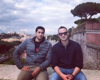 Amro Nassar and Karim Kherbache sitting outside