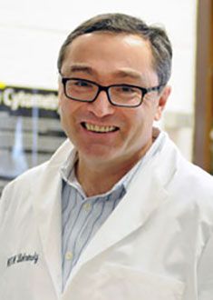 Dr. Michael Bukrinsky posing for a portrait