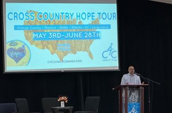 Hope Tour Panel Speaker in front of the Tour logo