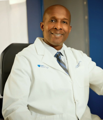 Damon Tweedy, MD, in white coat