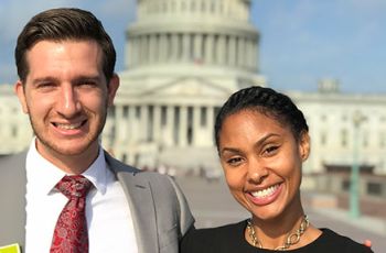 Tatum Little and Bradley Cundiff stand together in front of the U.S. Capitol 