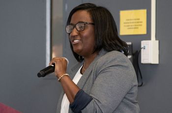 Dr. Hope Jackson speaking into a microphone