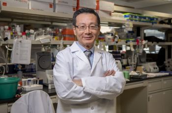 Dr. Rong Li standing in his lab