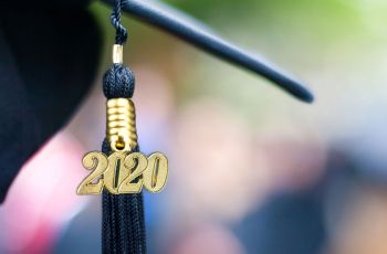 A graduation cap with a tassle that says 2020