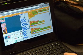 A laptop displaying an online game