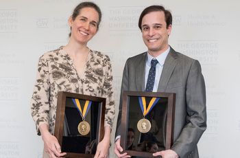 Drs. Scott Cohen and Aviva Ellenstein holding GW Distinguished Teacher awards