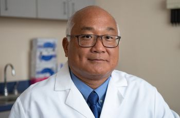 Dr. George Kim posing for a portrait