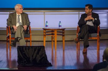 Drs. Anthony Caputy and Raj Rao sitting on a stage