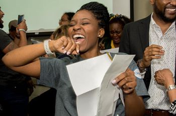 A GW medical student smiles and cheers at her residency match