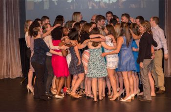 Physical Therapy Class of 2016 has a group hug on stage