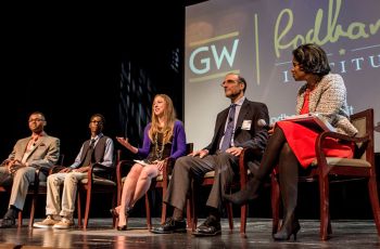 Marcus Andrews, Vertez Utley, Chelsea Clinton, Howell Wechsler, and Rea Blakely sitting on a stage