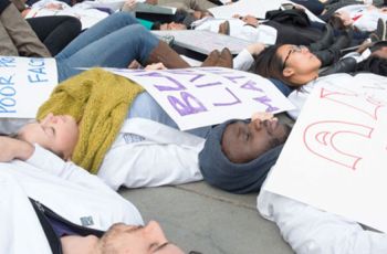 Medical students laying down on the street to demonstrate in solidarity with #WhiteCoats4BlackLives