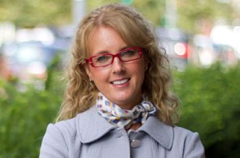 Dr. Lisa McGrail posing for a portrait outdoors