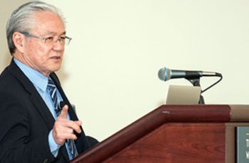 Dr. Joseph Takahashi speaking from a podium