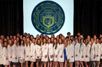 Physician Assistant Studies class of 2013 standing together in white coats