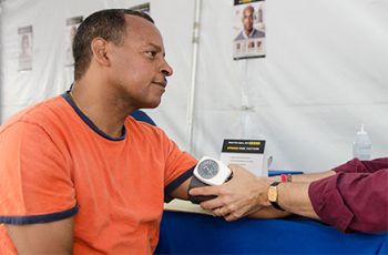 A patient receiving a blood pressure exam