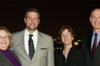 Christina M. Puchalski and Dean Akman pose for a photo with two people