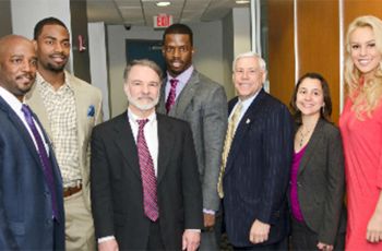 Gary Little, Arrelious Benn, Vince Chiappinell, Josh Morgan, Barry Wolfman, Mandi Chapman, and Britt McHenry standing together