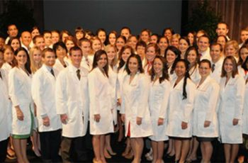 Physician Assistant students posing in white coats