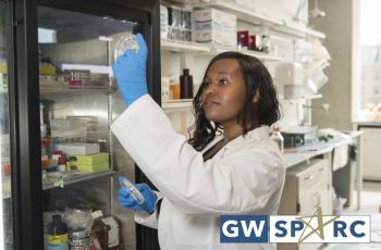 A woman is shown in a research lab