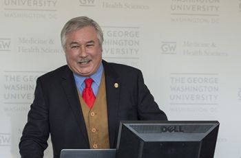 Michael Manyak, MD, at the podium