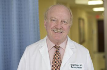 Morgan Delaney, MD, in white coat