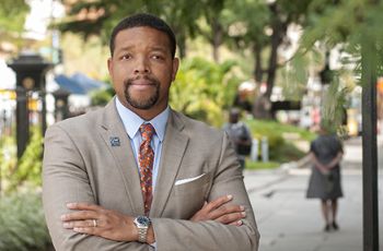 Lorenzo Norris, MD, outside Ross Hall, arms crossed