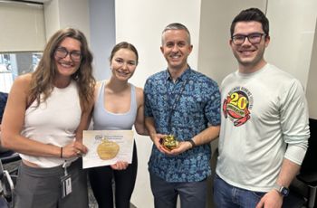 Johnson receives the Golden Apple Award from students