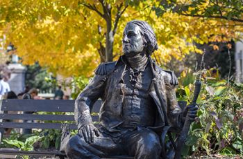 George Statue in Autumn with yellow leaves