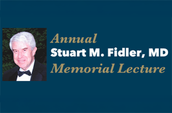 Photo Stuart Fidler with Annual Memorial Lecture banner