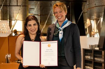 Zareen Zaidi, on left with Karolinska Institutet representative