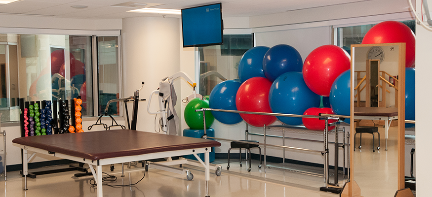 PT lab with exercise balls and a table